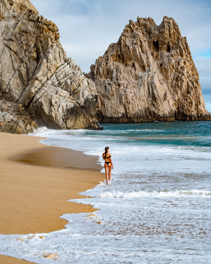 walking at the divorce beach in Cabo San Lucas Mexico