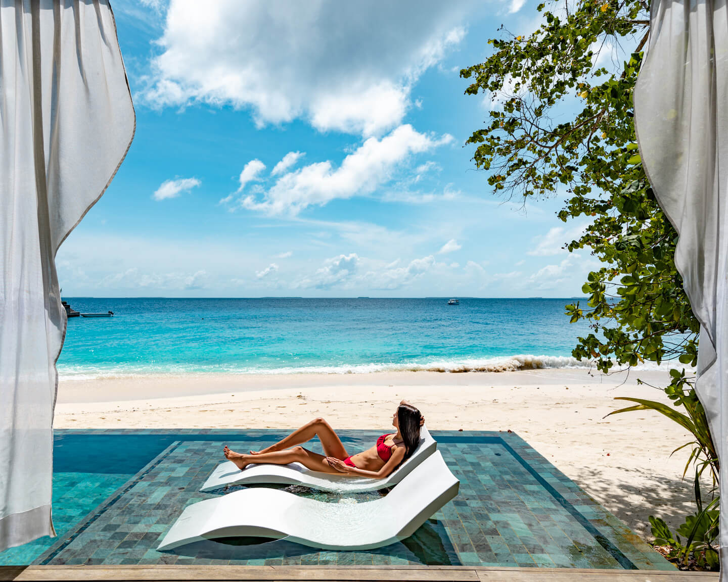 sunbeams in a pool by the beach in the maldives