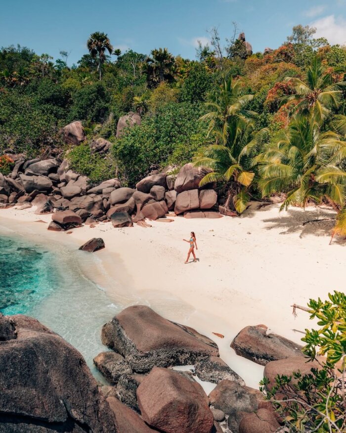 secret beach on Praslin, beautiful bay with blue water