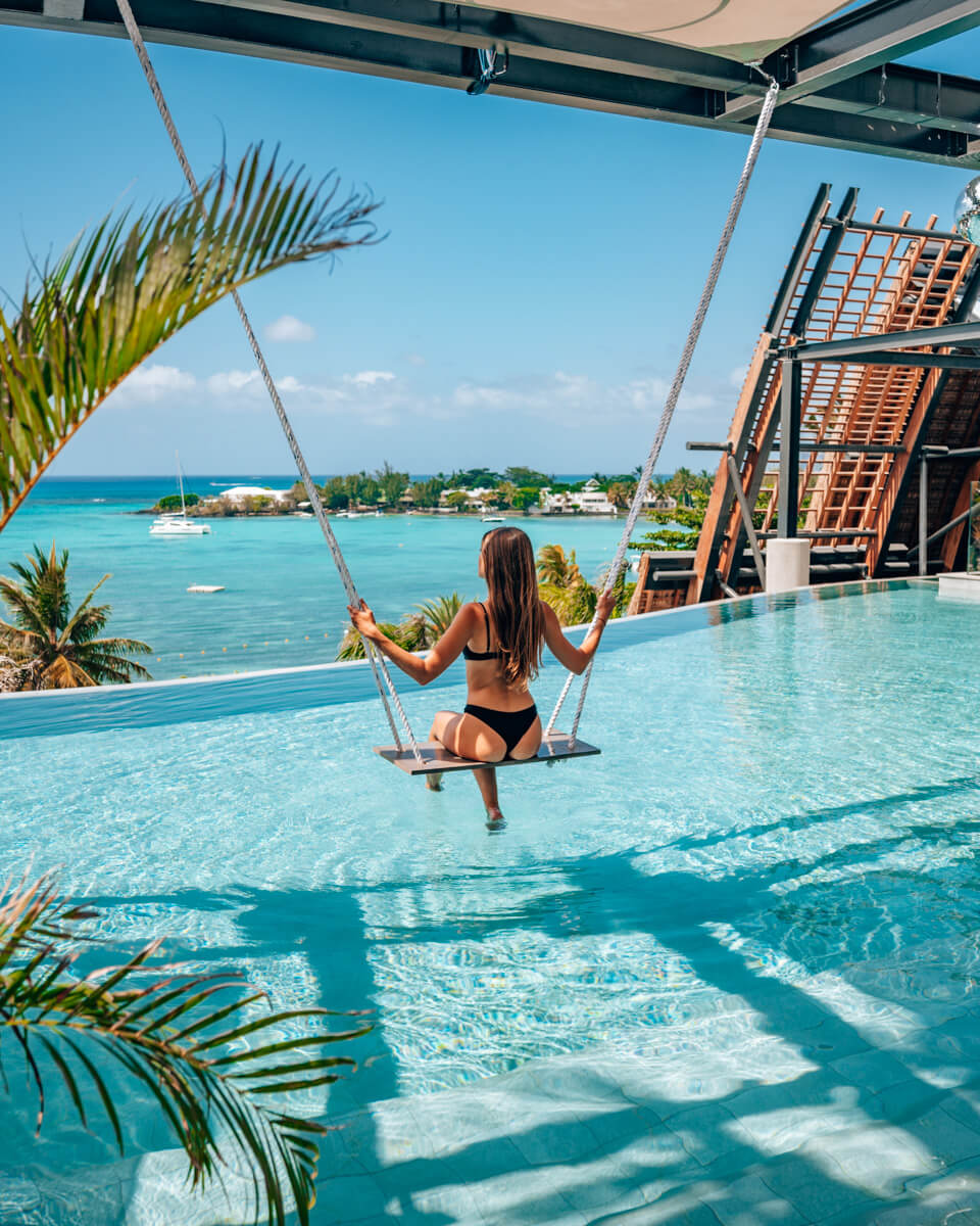 swing over infinity pool and view over LUX Grand Baie Mauritius