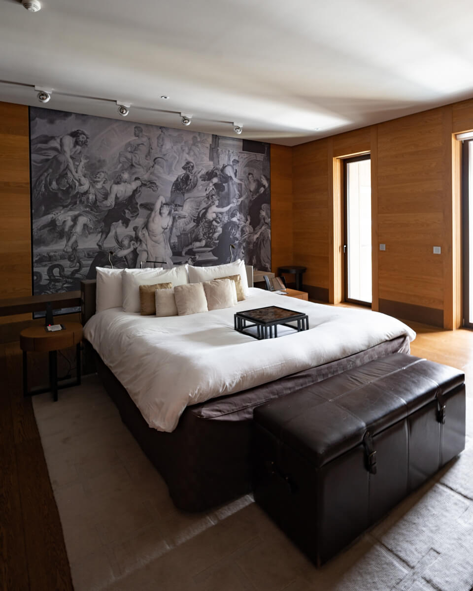 the cozy big bed in The Chedi Andermatt deluxe suite