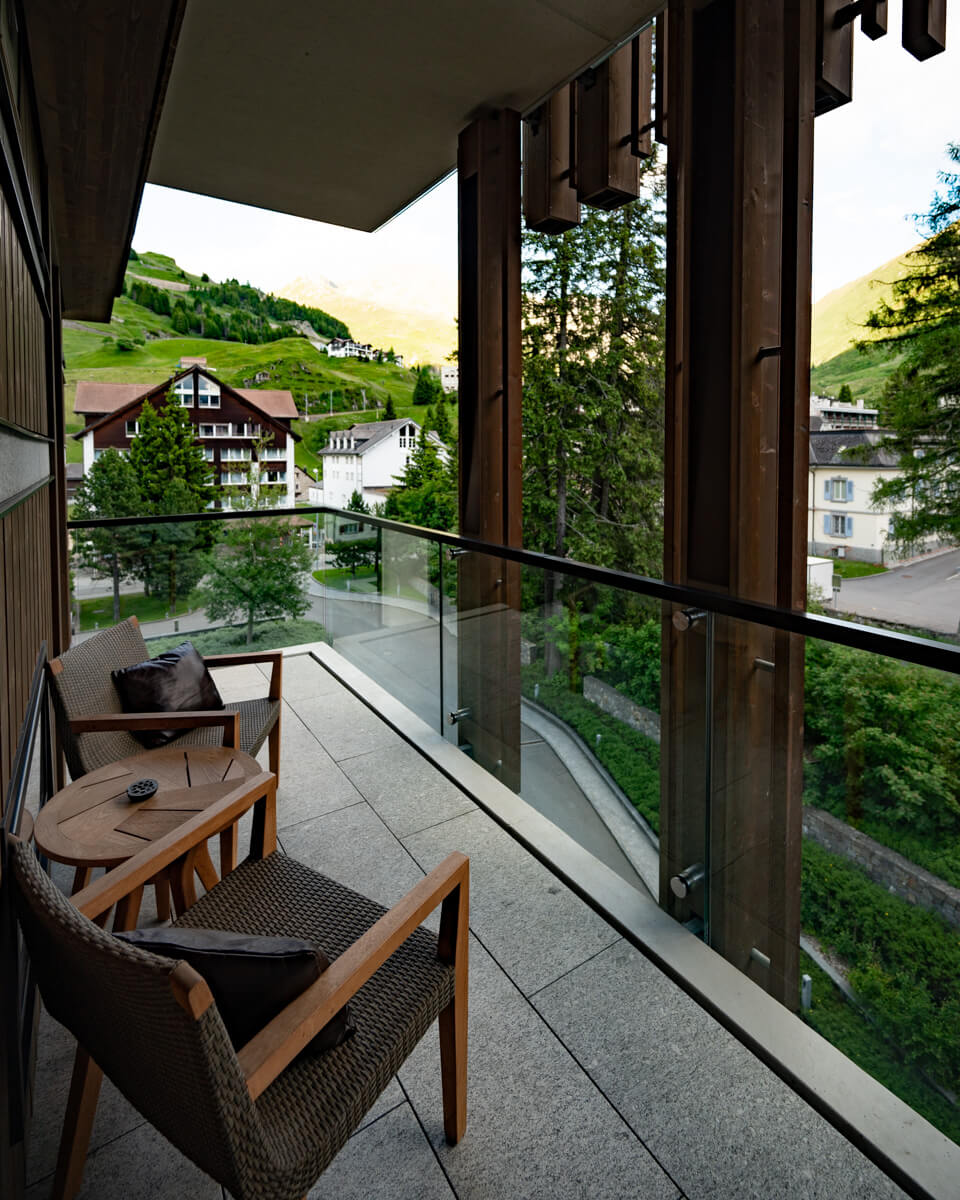 the view from a balcony at The Chedi Andermatt overlooking the mountains