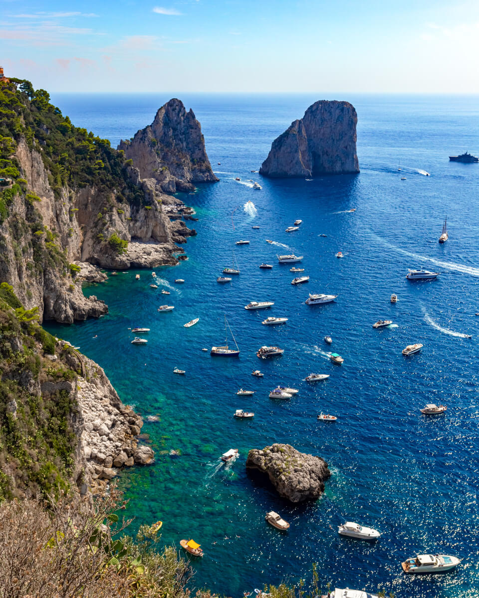 scenic view over capri island with blue water, boast and rock formations