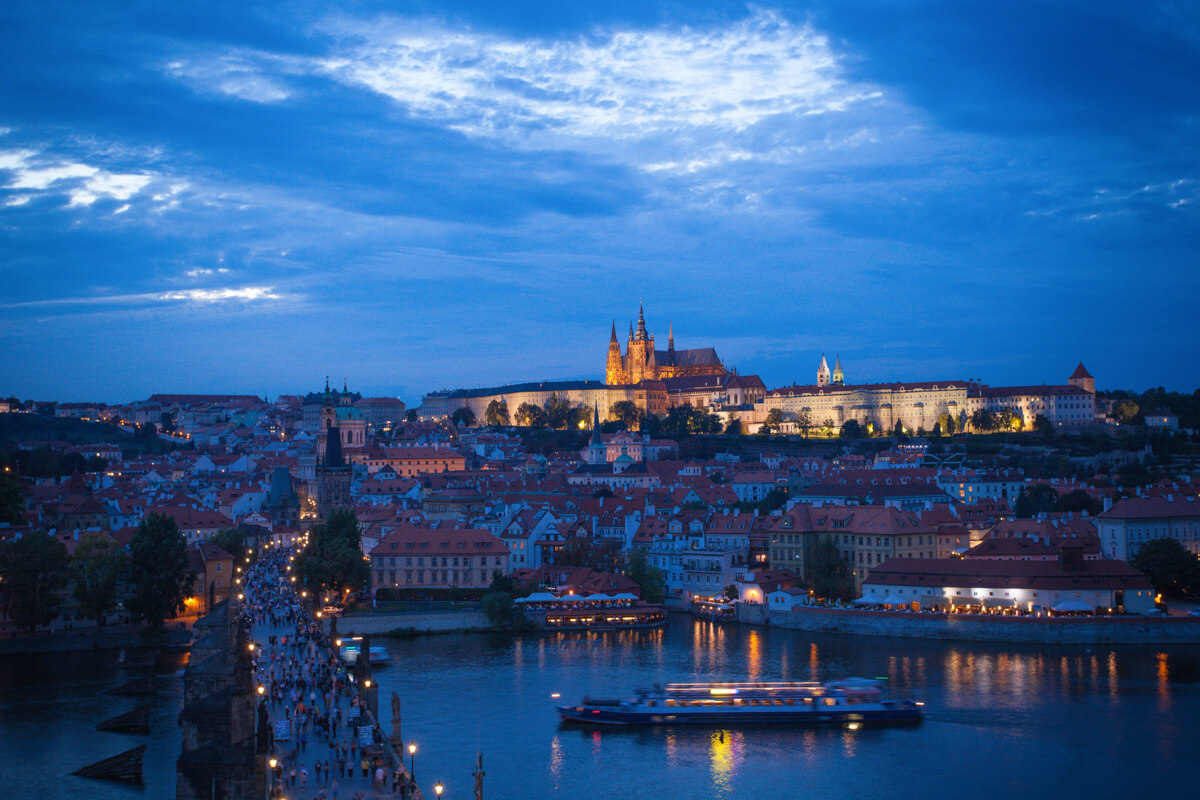 the castle of Prague at night, overlooking the city, its is one of the best sights in prague