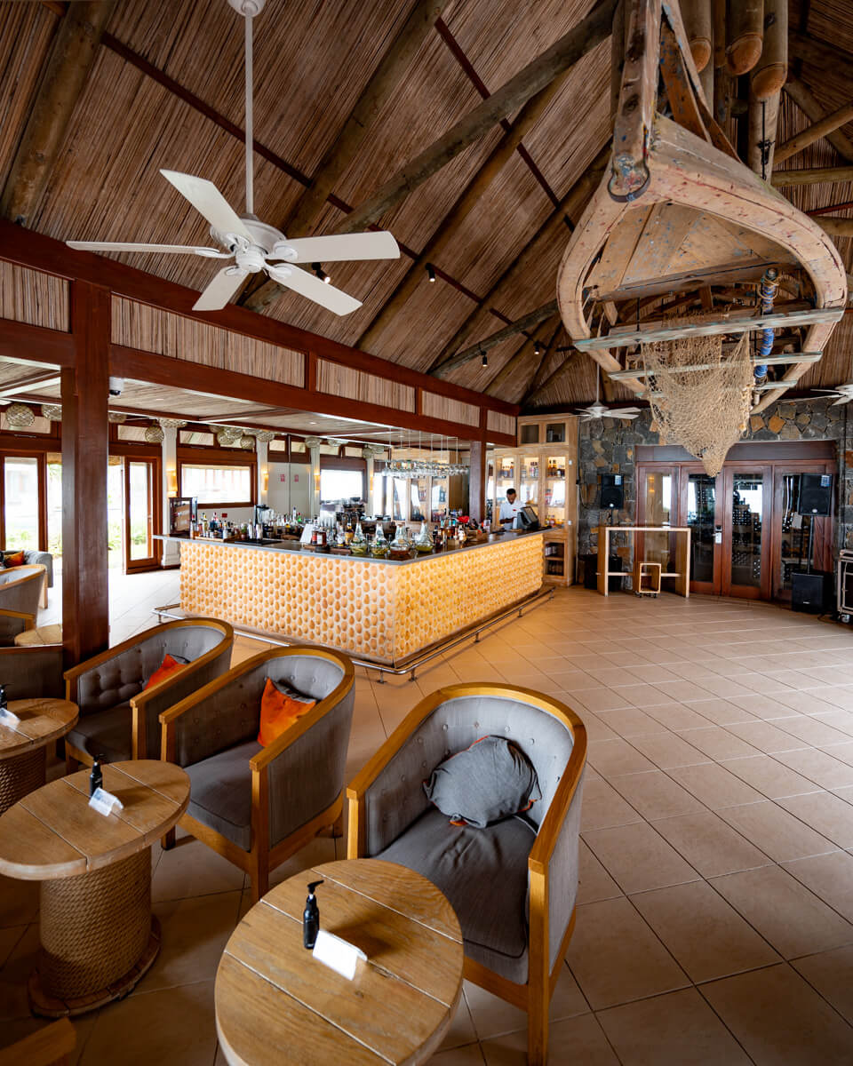 the bar at the C Mauritius resort with wooden design
