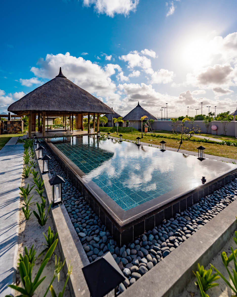 the spa area at the C Mauritius resort, with a pond