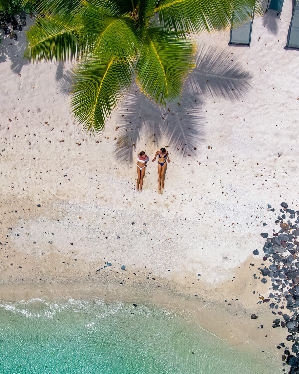 two girls laying at the le morne beach in Mauritius