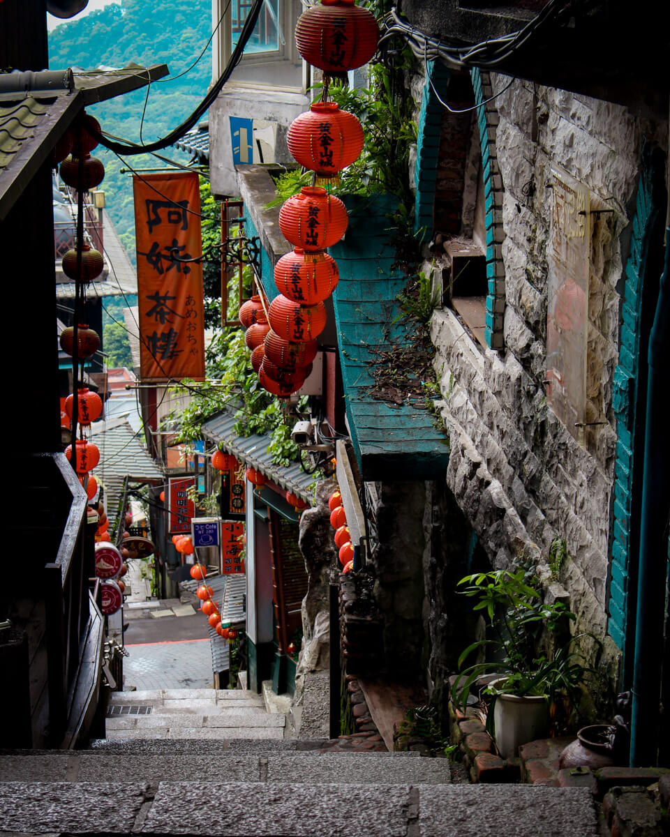 a narrow alley in Jiufen, Taiwan with red lampions