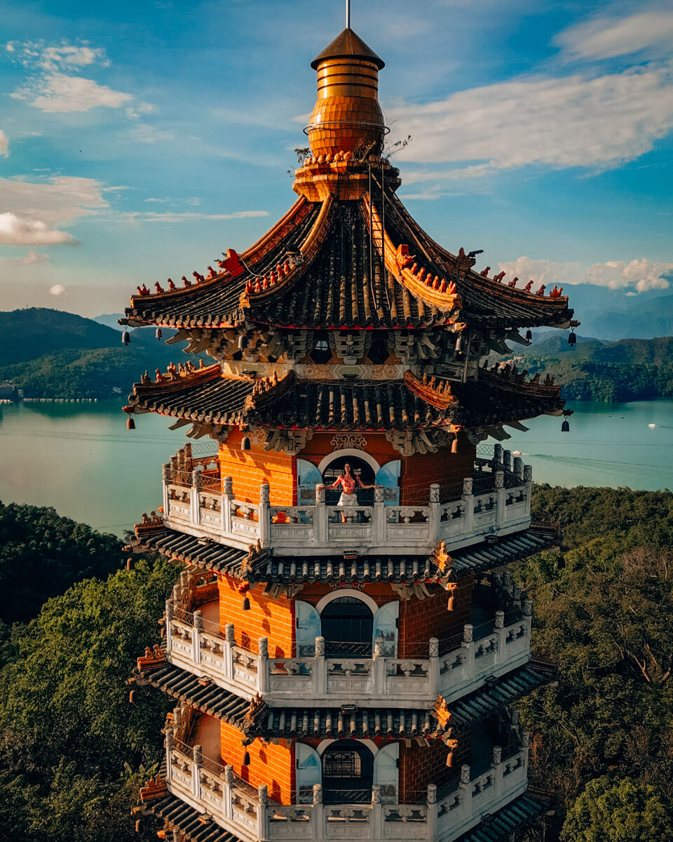 Standing on top of the Cien Pagoda in front of the Sun Moon Lake in Taiwan