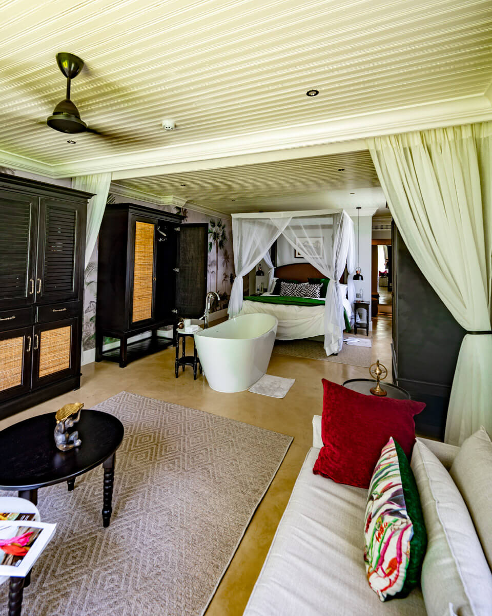 the interior of a suite with sofa. bathtub and bed at the Royal Livingstone Hotel in Zambia
