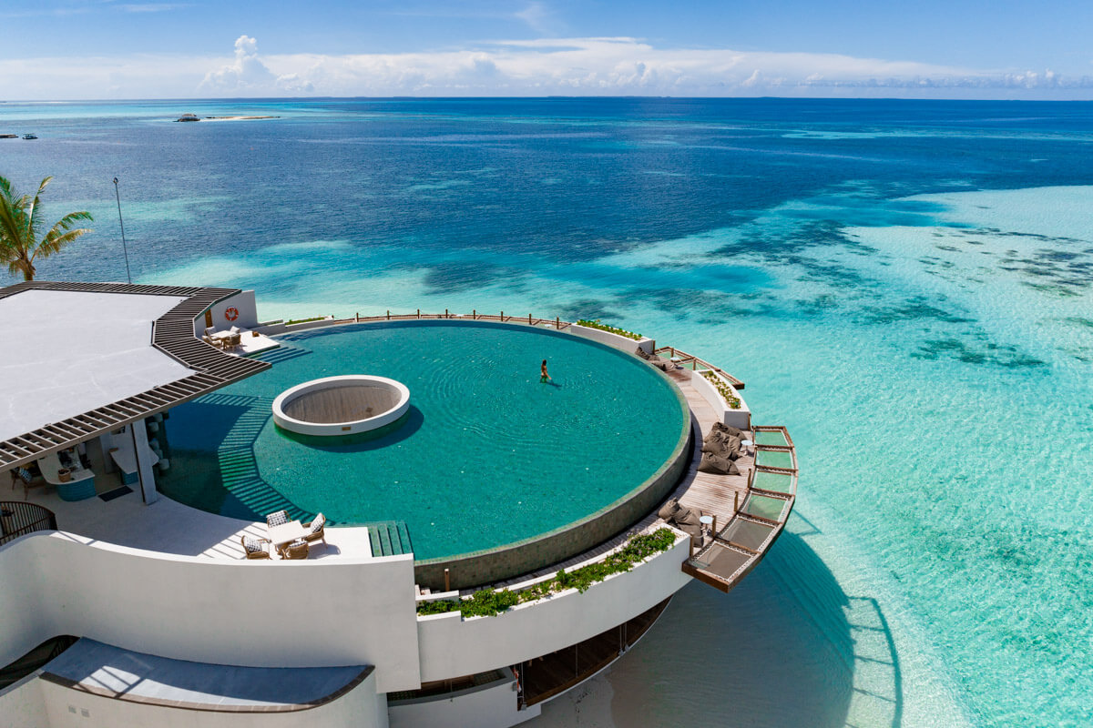 The infinity pool at the Six Senses Kanuhura in the Maldives overlooking the blue lagoon