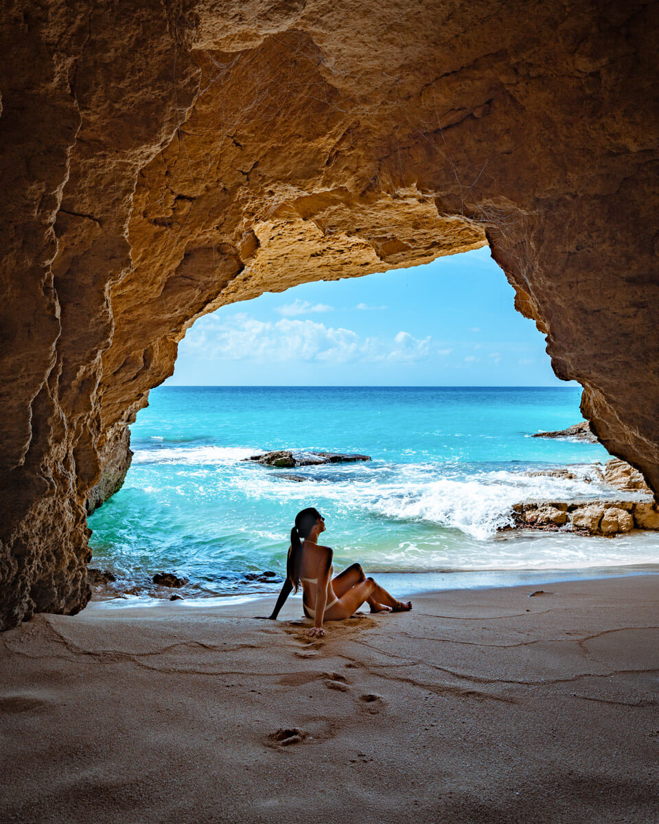 sitting in a beach cave in st. Martin, one of the best attractions