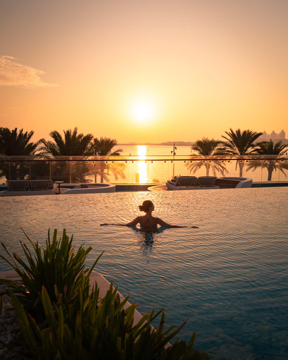 sunrise at the pool of the raffles in doha