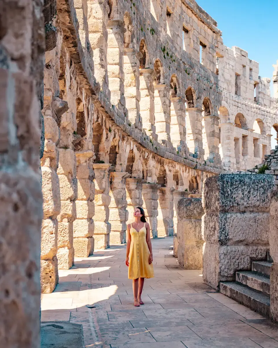 walking through the ruins of the Pula arena, one of the best preserved amphitheaters in the world, sight in Croatia