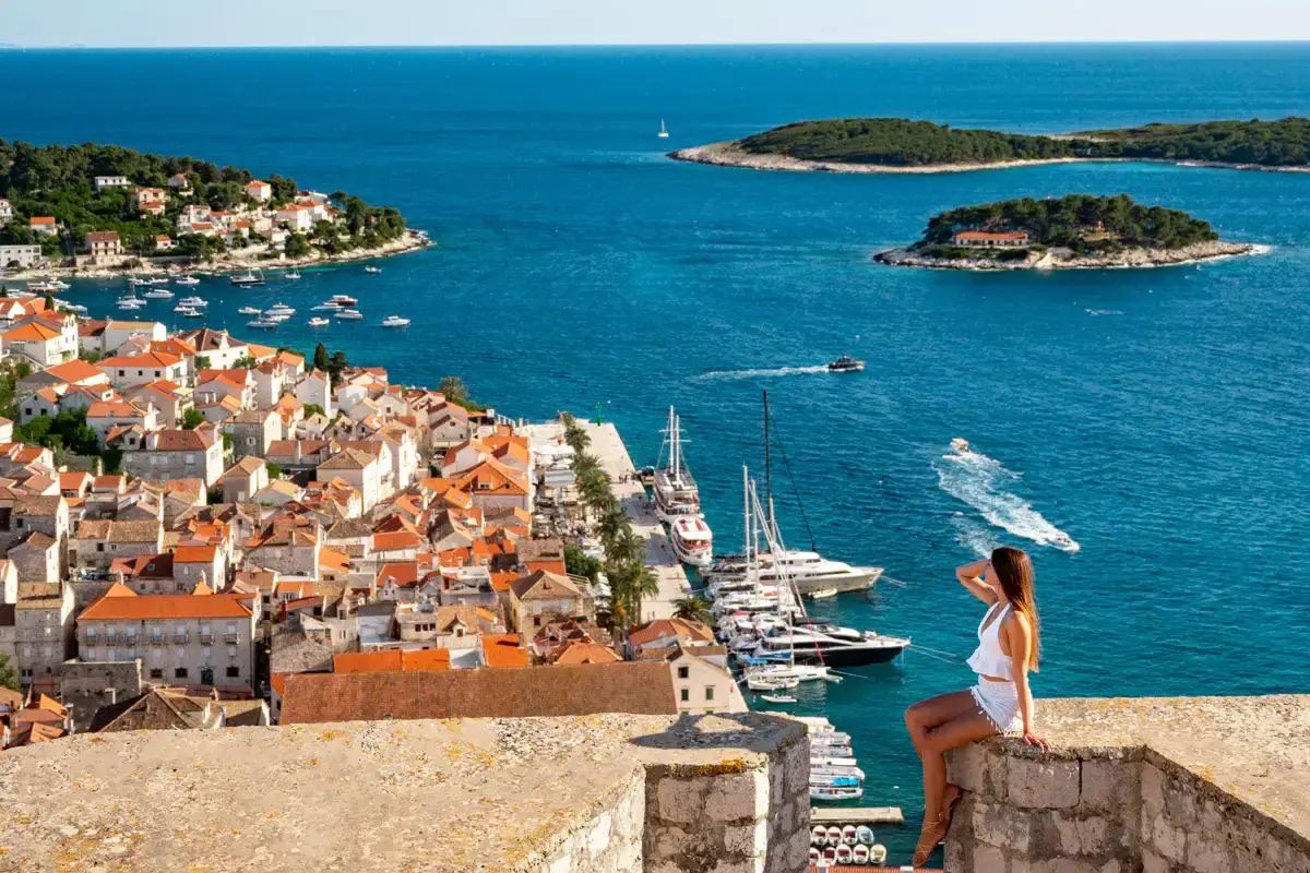 sitting on the ruins of the Spanish Fortress in Hvar, a beautiful island in Croatia