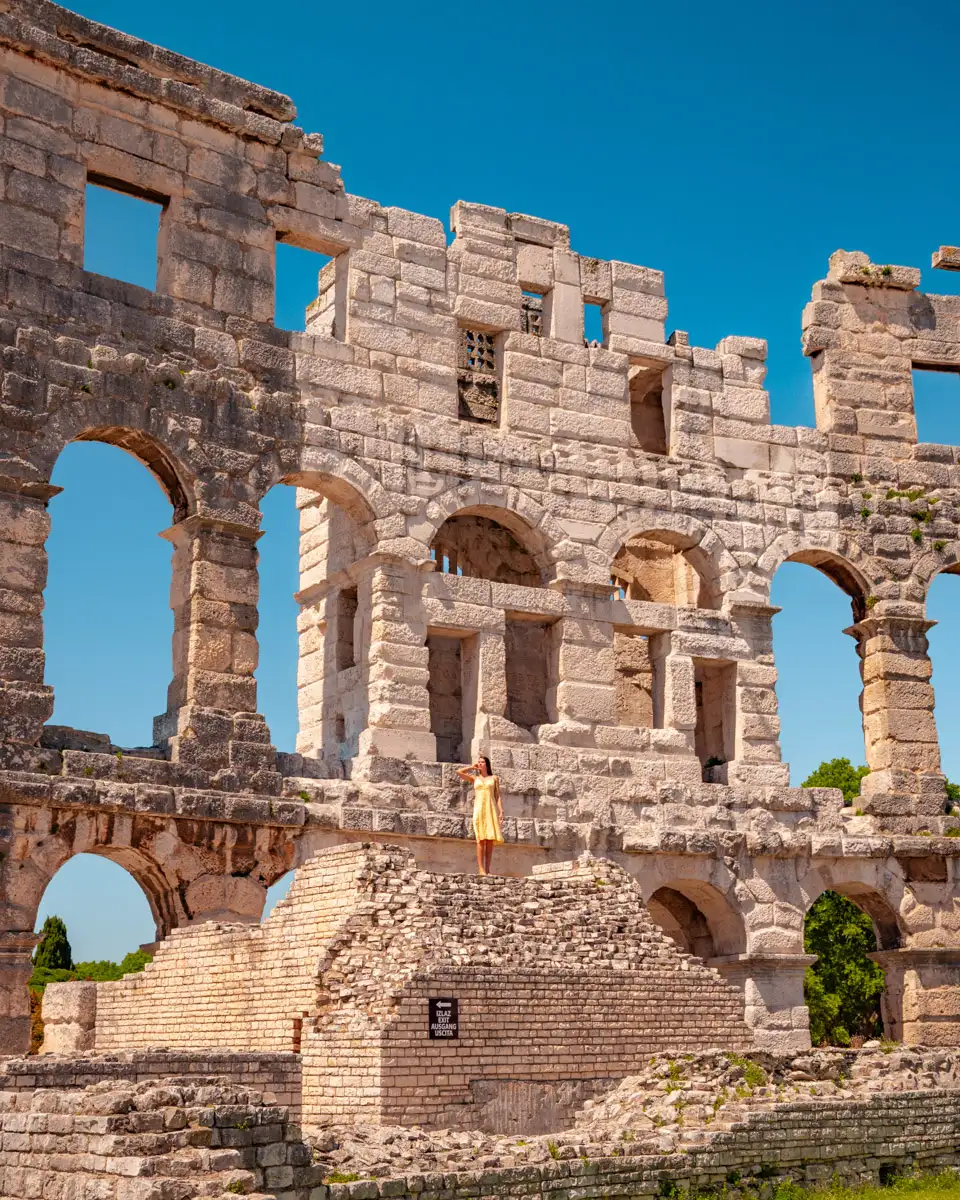 walking through the ruins of the Pula arena, one of the best preserved amphitheaters in the world, sight in Croatia