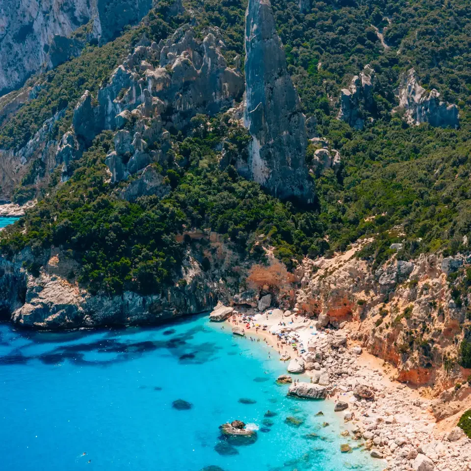 Cala Goloritze, the most beautiful beach on Sardinia with an iconic rock formation, white sandy beach and blue water