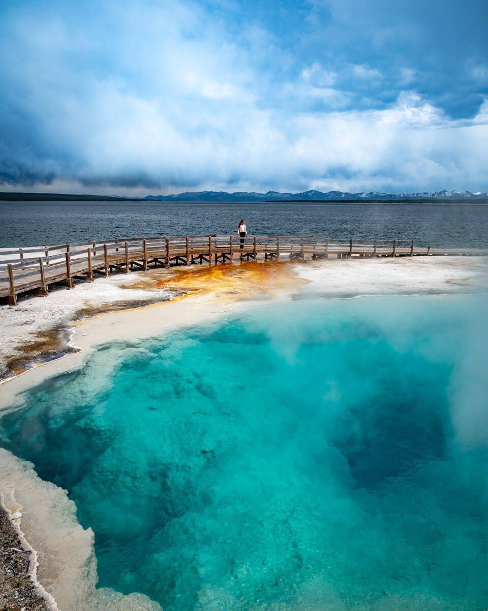 west-thumb-geyser-yellowstone West thumb geyser, a hot turquoise blue pool in Yellowstone national park, highlight